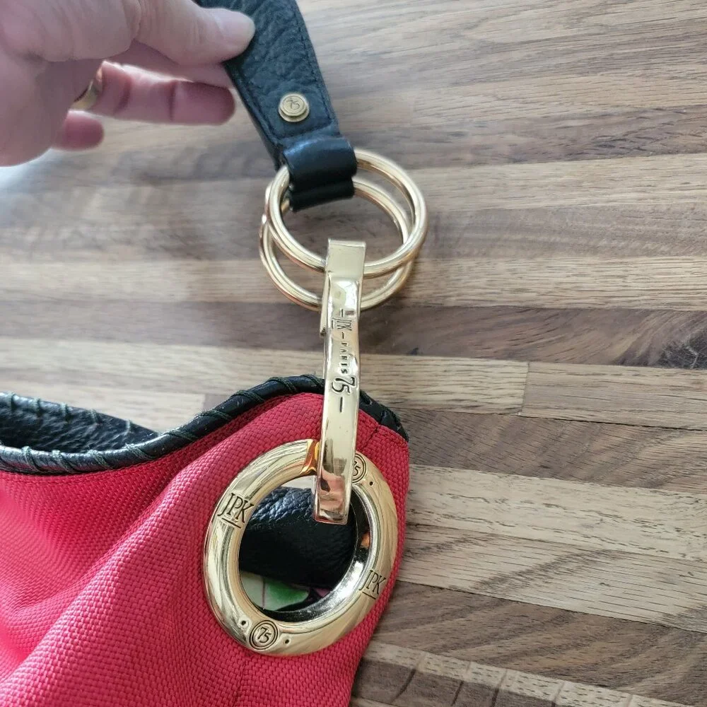JPK Paris 75 hobo bucket shoulder bag in red nylon with a floral lining
